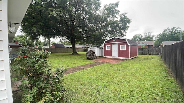 219 N Anthony St, Muskogee, OK 74403 - fenced backyard featuring a storage unit