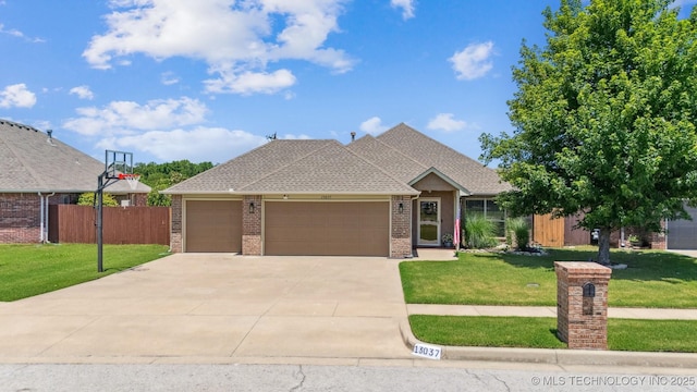 13037 N 124th E Pl, Collinsville, OK 74021 - view of front of house with brick siding, a garage, driveway, and a shingled roof