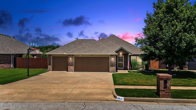 13037 N 124th E Pl, Collinsville, OK 74021 - view of front facade featuring an attached garage, brick siding, and driveway