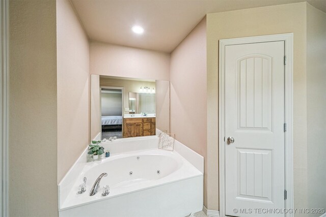 13037 N 124th E Pl, Collinsville, OK 74021 - bathroom with a whirlpool tub and vanity