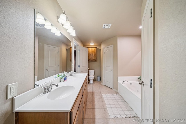 13037 N 124th E Pl, Collinsville, OK 74021 - bathroom with double vanity, a bath, tile patterned flooring, and a textured wall