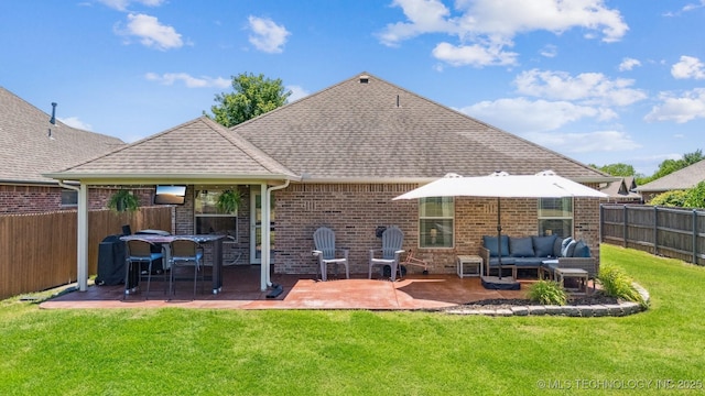 13037 N 124th E Pl, Collinsville, OK 74021 - back of house featuring outdoor lounge area, a fenced backyard, brick siding, roof with shingles, and a patio