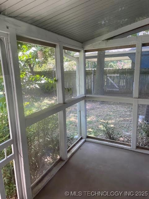 5003 S Boston Ave, Tulsa, OK 74105 - unfurnished sunroom featuring concrete floors and healthy amount of natural light