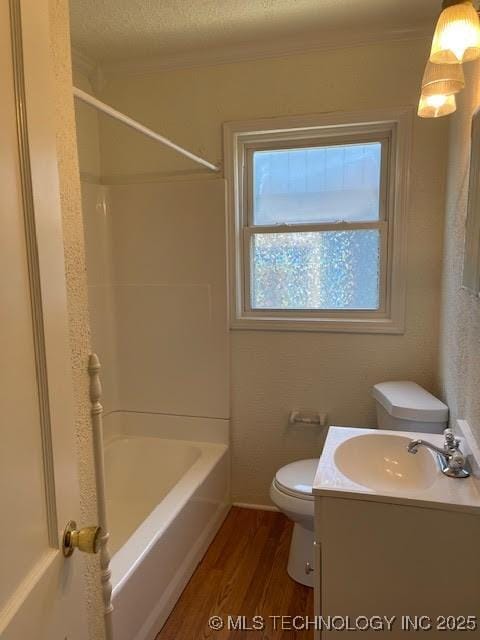5003 S Boston Ave, Tulsa, OK 74105 - bathroom with wood finished floors, vanity, bathtub / shower combination, a textured ceiling, and crown molding