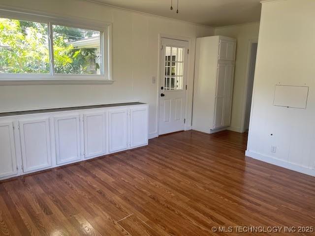 5003 S Boston Ave, Tulsa, OK 74105 - spare room with wood finished floors and ornamental molding