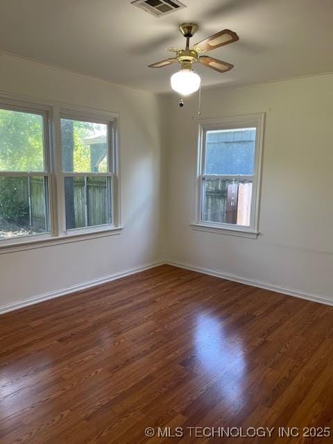 5003 S Boston Ave, Tulsa, OK 74105 - unfurnished room with healthy amount of natural light, wood finished floors, and ceiling fan
