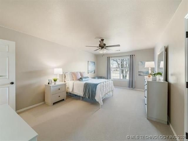 408 W Fairway Ct, Broken Arrow, OK 74011 - bedroom featuring light colored carpet and ceiling fan