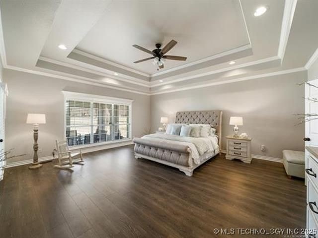 408 W Fairway Ct, Broken Arrow, OK 74011 - bedroom featuring a tray ceiling, ornamental molding, wood finished floors, recessed lighting, and ceiling fan