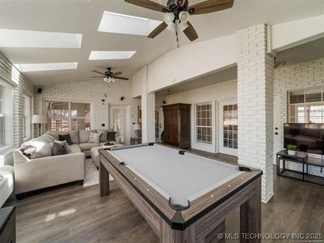 408 W Fairway Ct, Broken Arrow, OK 74011 - recreation room with a ceiling fan, vaulted ceiling, dark wood-type flooring, pool table, and a skylight