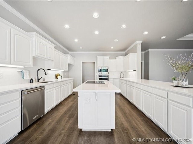 408 W Fairway Ct, Broken Arrow, OK 74011 - kitchen featuring stainless steel appliances, ornamental molding, white cabinets, dark wood finished floors, and light countertops