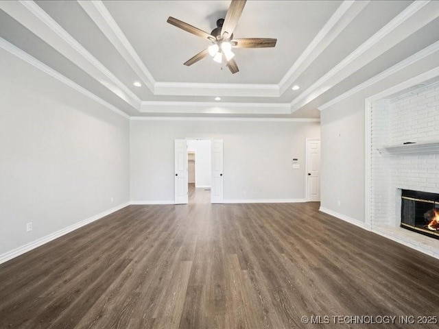 408 W Fairway Ct, Broken Arrow, OK 74011 - unfurnished living room with a tray ceiling, ceiling fan, a fireplace, dark wood-style floors, and recessed lighting