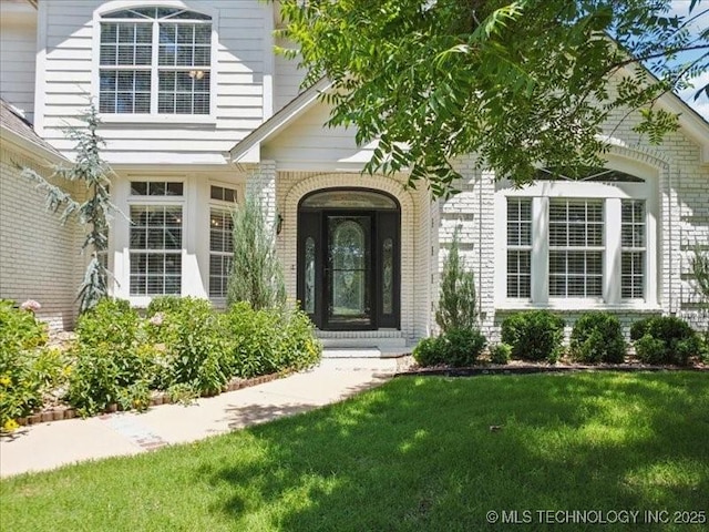 408 W Fairway Ct, Broken Arrow, OK 74011 - property entrance featuring brick siding and a yard