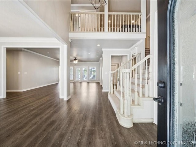 408 W Fairway Ct, Broken Arrow, OK 74011 - foyer with wood finished floors, a towering ceiling, ornamental molding, stairway, and a ceiling fan