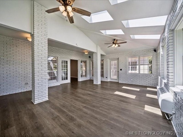408 W Fairway Ct, Broken Arrow, OK 74011 - unfurnished living room featuring brick wall, a ceiling fan, a skylight, wood finished floors, and high vaulted ceiling