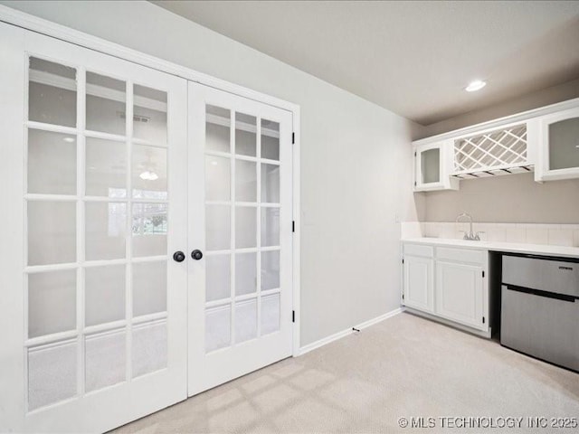 408 W Fairway Ct, Broken Arrow, OK 74011 - kitchen featuring french doors, light colored carpet, white cabinetry, light countertops, and recessed lighting