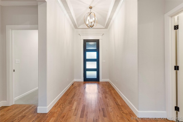 5913 E 127th St S, Tulsa, OK 74008 - foyer with light wood finished floors, a chandelier, and crown molding