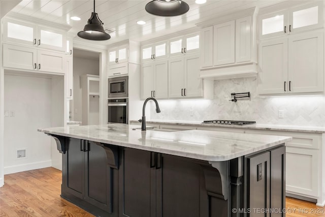 5913 E 127th St S, Tulsa, OK 74008 - kitchen featuring appliances with stainless steel finishes, white cabinets, tasteful backsplash, a kitchen breakfast bar, and recessed lighting