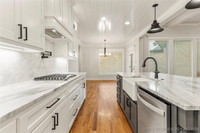 5913 E 127th St S, Tulsa, OK 74008 - kitchen featuring stainless steel appliances, white cabinetry, recessed lighting, light wood finished floors, and a chandelier
