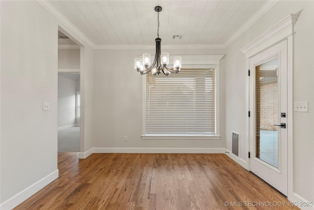 5913 E 127th St S, Tulsa, OK 74008 - unfurnished dining area featuring a chandelier, crown molding, and wood finished floors