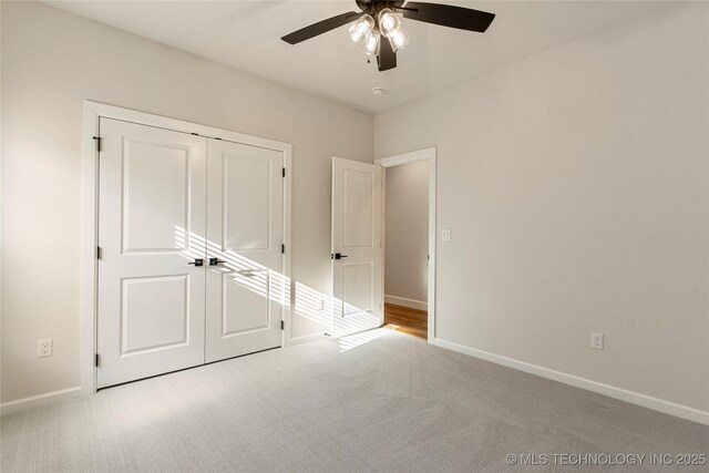 5913 E 127th St S, Tulsa, OK 74008 - unfurnished bedroom with carpet, a closet, and a ceiling fan