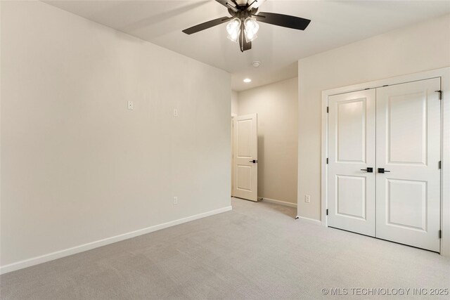 5913 E 127th St S, Tulsa, OK 74008 - unfurnished bedroom with light colored carpet, recessed lighting, a closet, and a ceiling fan