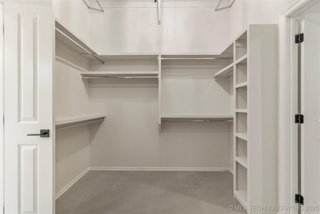 5913 E 127th St S, Tulsa, OK 74008 - walk in closet with carpet flooring