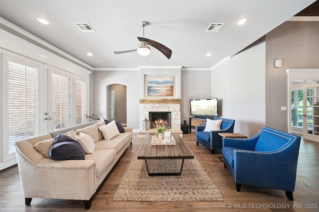 27920 160th St, Coweta, OK 74429 - living area with ceiling fan, ornamental molding, arched walkways, a fireplace, and wood finished floors