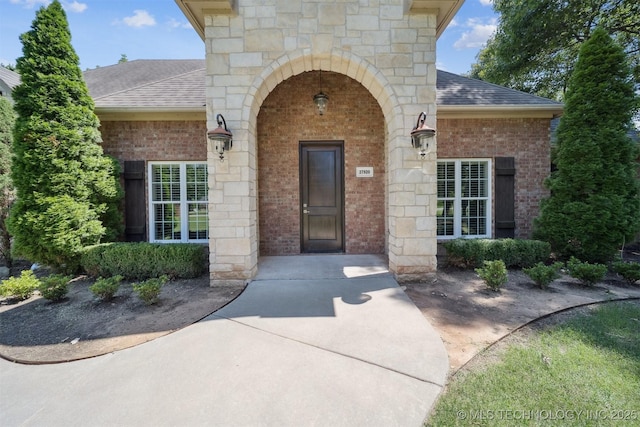 27920 160th St, Coweta, OK 74429 - property entrance with roof with shingles and brick siding