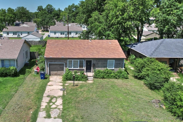 217 E 38th Pl, Tulsa, OK 74105 - ranch-style home with concrete driveway, an attached garage, a residential view, and a front lawn