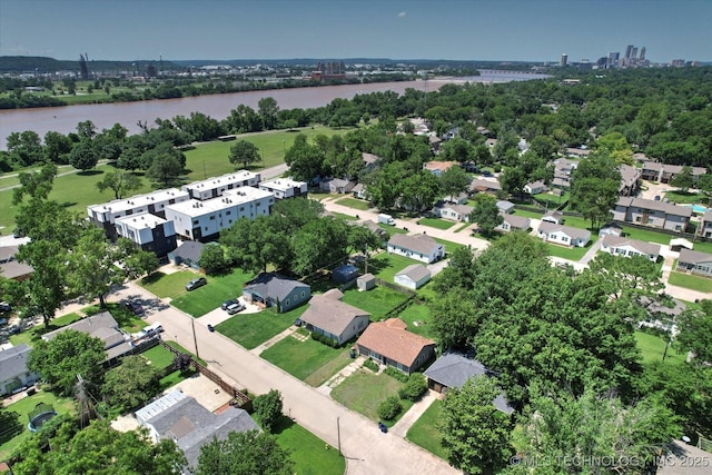 217 E 38th Pl, Tulsa, OK 74105 - aerial overview of property's location featuring a nearby body of water and a tree filled landscape