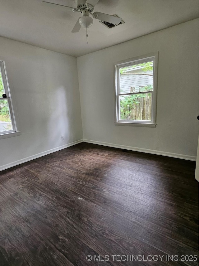 306 G St SE, Ardmore, OK 73401 - unfurnished room with dark wood-style floors and ceiling fan