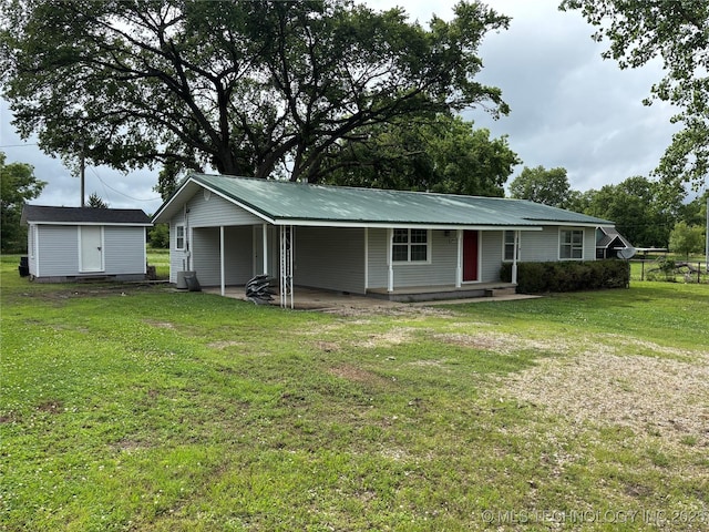 18969 County Road 3560, Ada, OK 74820 - ranch-style house featuring a front lawn and a storage shed