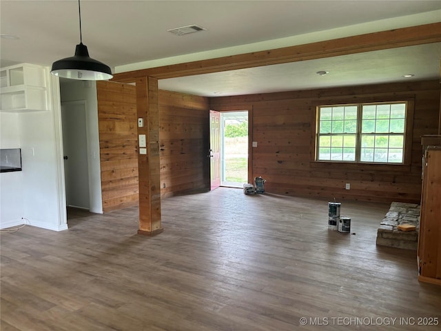 18969 County Road 3560, Ada, OK 74820 - unfurnished living room featuring wood walls and wood finished floors