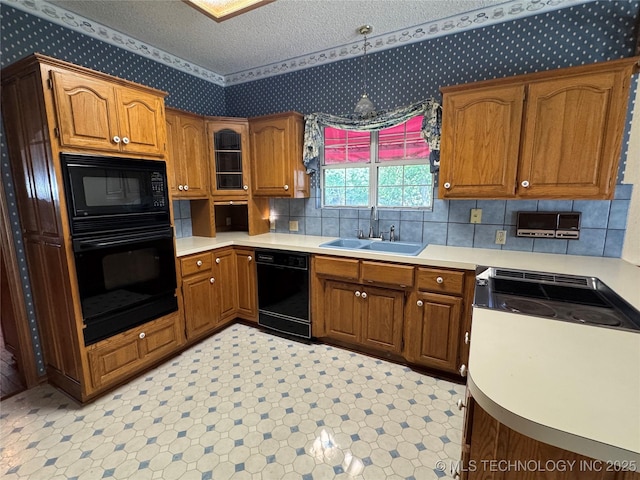 4525 Summit Pl, Sand Springs, OK 74063 - kitchen featuring black appliances, wallpapered walls, brown cabinets, light countertops, and a textured ceiling