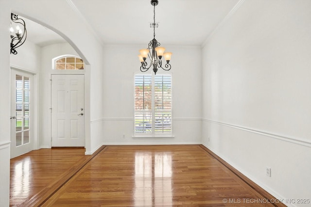 1005 E Fargo St, Broken Arrow, OK 74012 - entrance foyer with a chandelier, healthy amount of natural light, wood finished floors, and ornamental molding