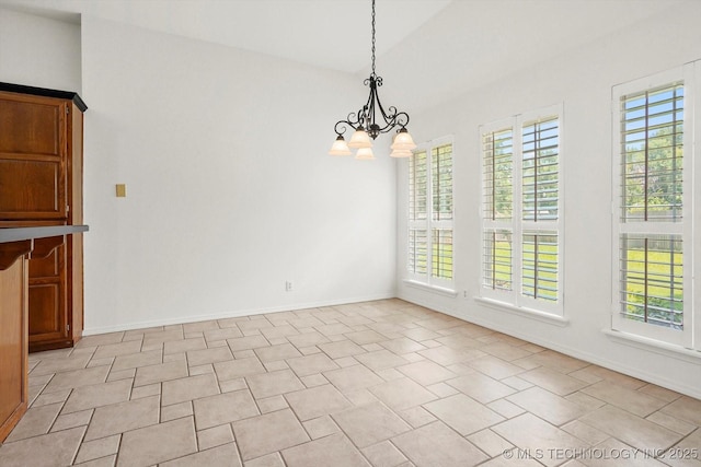 1005 E Fargo St, Broken Arrow, OK 74012 - unfurnished dining area with a chandelier and baseboards