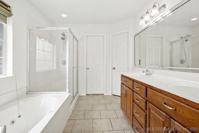 1005 E Fargo St, Broken Arrow, OK 74012 - bathroom featuring a shower stall, double vanity, a tub with jets, tile patterned flooring, and recessed lighting