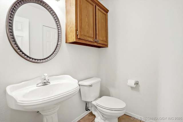 1005 E Fargo St, Broken Arrow, OK 74012 - half bath with baseboards and tile patterned flooring