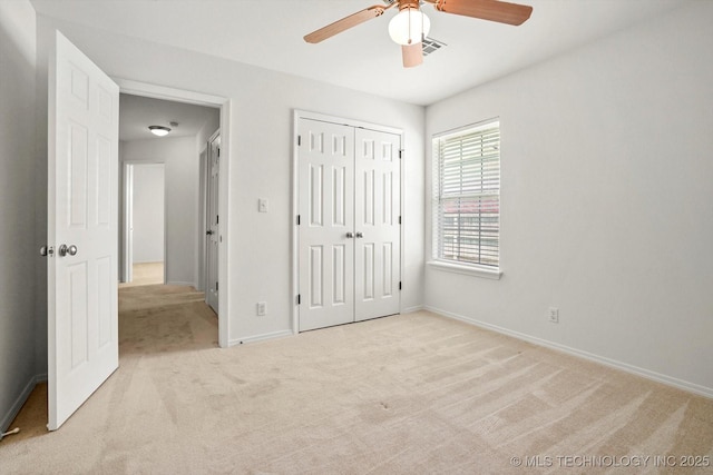 1005 E Fargo St, Broken Arrow, OK 74012 - unfurnished bedroom featuring carpet, a closet, and a ceiling fan