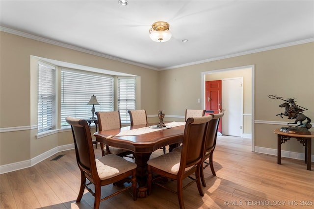6016 E 52nd Pl, Tulsa, OK 74135 - dining area featuring ornamental molding and light wood-type flooring