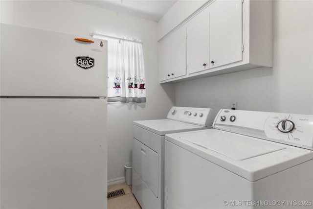 6016 E 52nd Pl, Tulsa, OK 74135 - washroom with cabinet space and washing machine and clothes dryer