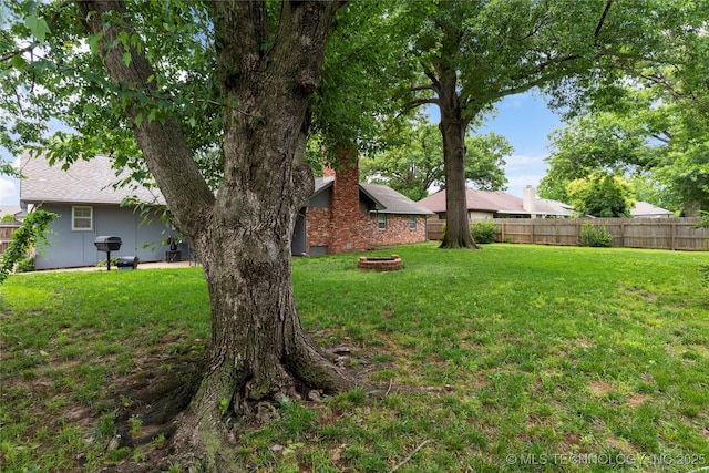 6016 E 52nd Pl, Tulsa, OK 74135 - view of yard featuring an outdoor fire pit
