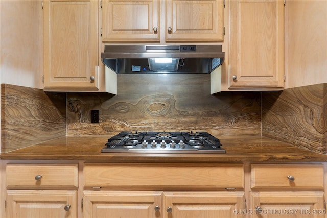 6016 E 52nd Pl, Tulsa, OK 74135 - kitchen featuring exhaust hood, light brown cabinets, stainless steel gas cooktop, backsplash, and dark countertops