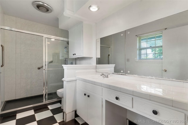 6016 E 52nd Pl, Tulsa, OK 74135 - full bathroom featuring tile patterned floors, a shower stall, and vanity