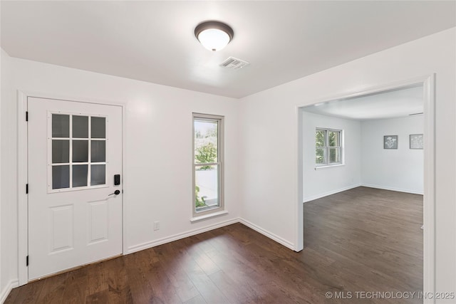 1800 N 26th St, Broken Arrow, OK 74014 - foyer entrance featuring dark wood-type flooring and baseboards