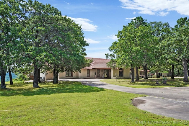 17331 S 174th Ave E, Bixby, OK 74008 - view of property hidden behind natural elements with curved driveway and a front lawn