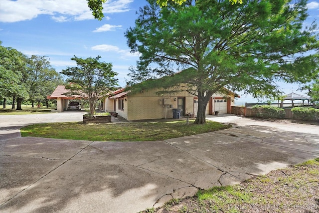 17331 S 174th Ave E, Bixby, OK 74008 - view of front of property with driveway, a garage, brick siding, and a gazebo