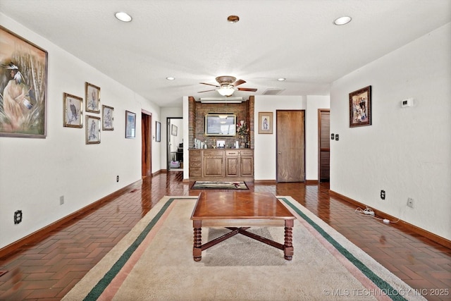 17331 S 174th Ave E, Bixby, OK 74008 - living room featuring recessed lighting, ceiling fan, and brick floors