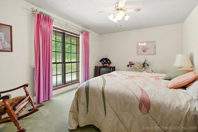 17331 S 174th Ave E, Bixby, OK 74008 - bedroom with carpet, a textured ceiling, and a ceiling fan