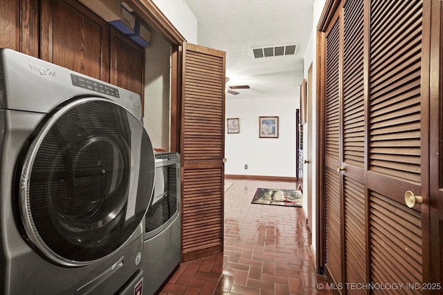 17331 S 174th Ave E, Bixby, OK 74008 - washroom featuring washer / dryer, brick floors, a ceiling fan, and a textured ceiling